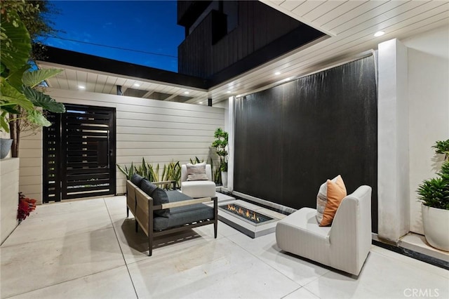 exterior space featuring an outdoor fire pit