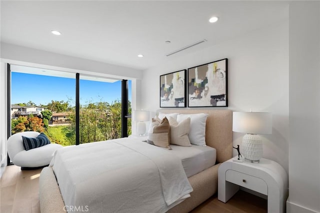 bedroom with hardwood / wood-style flooring