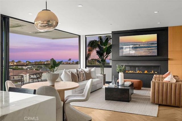 living room featuring parquet floors and a fireplace