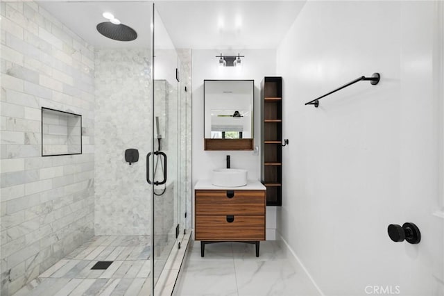 bathroom featuring vanity and a shower with shower door