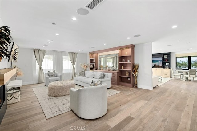 living room with light hardwood / wood-style floors