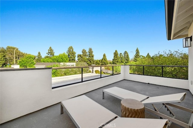 view of patio featuring a balcony