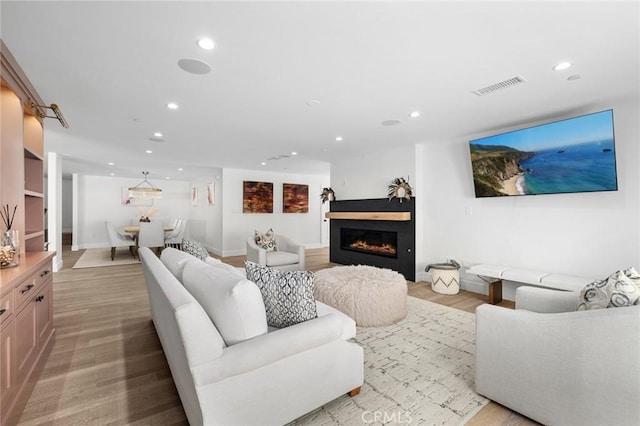 living room with light hardwood / wood-style floors