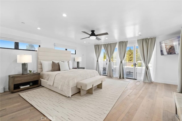 bedroom with ceiling fan, access to exterior, and light hardwood / wood-style flooring