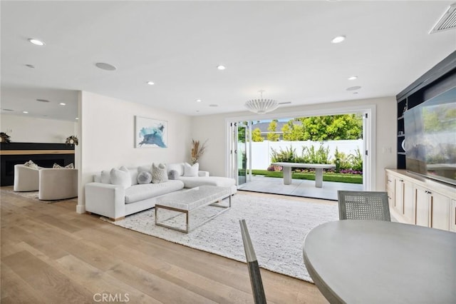 living room with light hardwood / wood-style floors