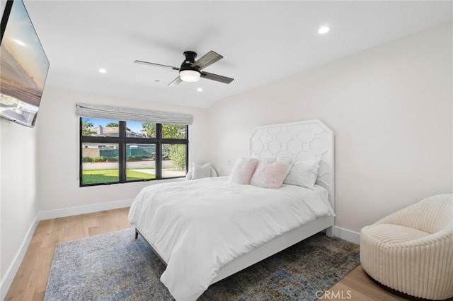 bedroom with light hardwood / wood-style flooring and ceiling fan