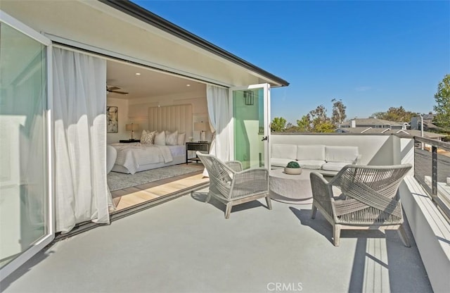 view of patio with a balcony and an outdoor hangout area