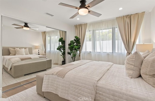 bedroom with visible vents, multiple windows, recessed lighting, and a ceiling fan
