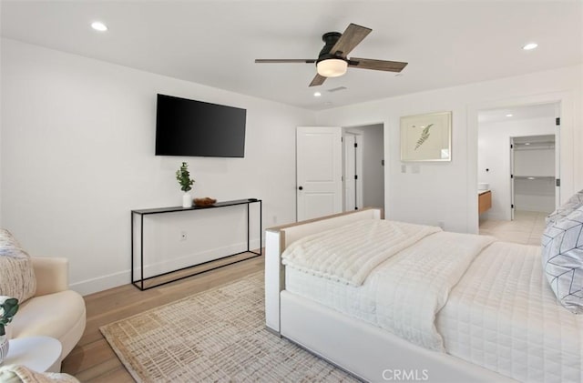 bedroom with recessed lighting, light wood-style floors, baseboards, and a ceiling fan