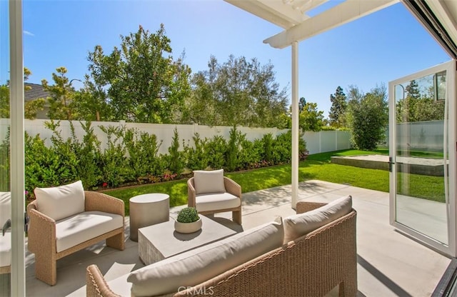 view of patio / terrace featuring an outdoor living space, a fenced backyard, and a pergola
