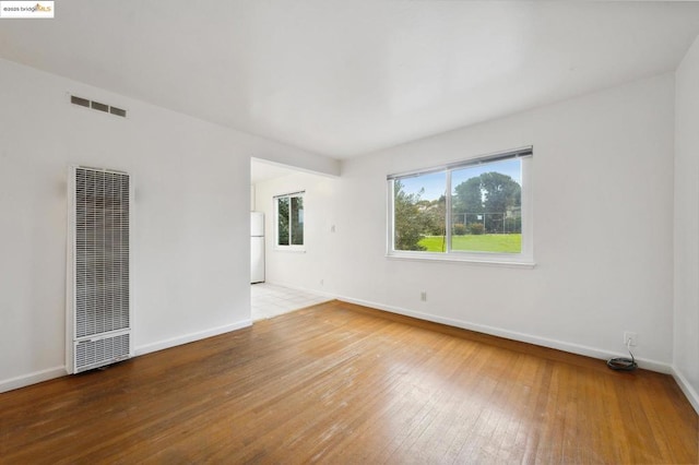 empty room featuring hardwood / wood-style floors