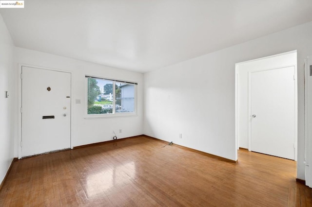 foyer entrance with hardwood / wood-style flooring