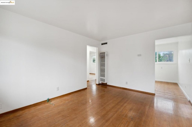 unfurnished room featuring wood-type flooring