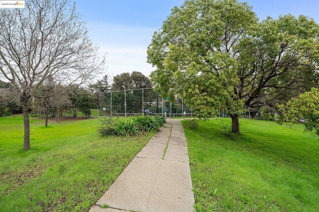 view of home's community featuring a lawn