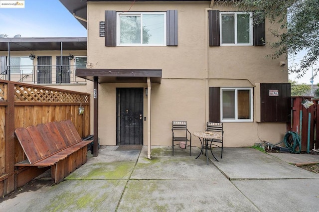 rear view of house featuring a patio