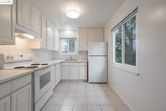 kitchen with sink, white appliances, white cabinetry, backsplash, and light tile patterned flooring