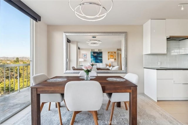 dining room with light hardwood / wood-style floors and floor to ceiling windows