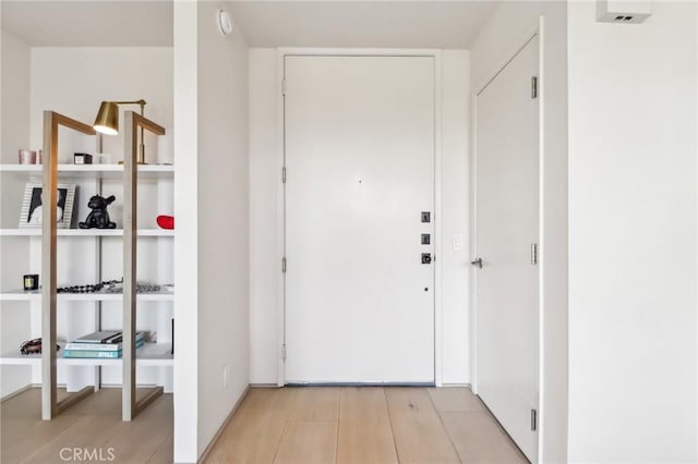 entryway with light hardwood / wood-style floors