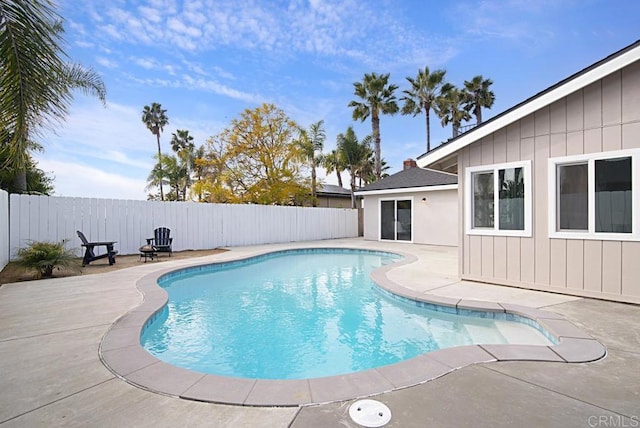 view of swimming pool with a fenced in pool, a fenced backyard, and a patio