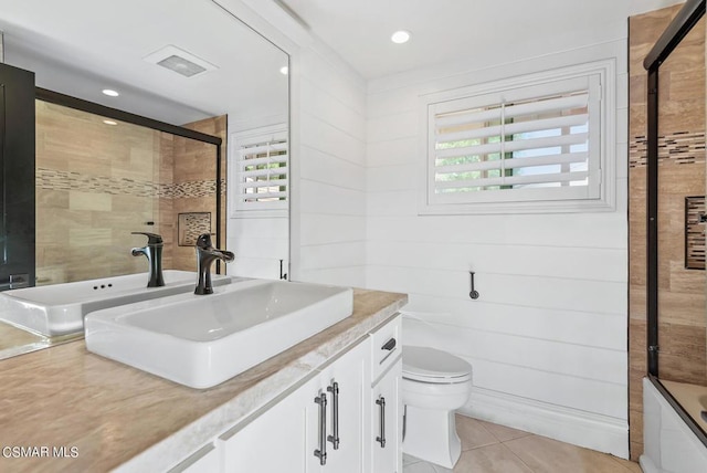 full bathroom featuring vanity, tile patterned floors, enclosed tub / shower combo, and toilet