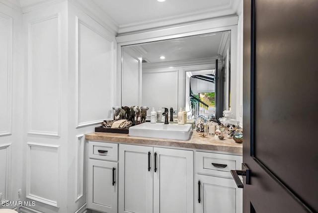 bar featuring white cabinetry, ornamental molding, and sink