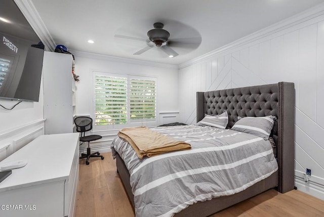 bedroom with ornamental molding, ceiling fan, and light wood-type flooring