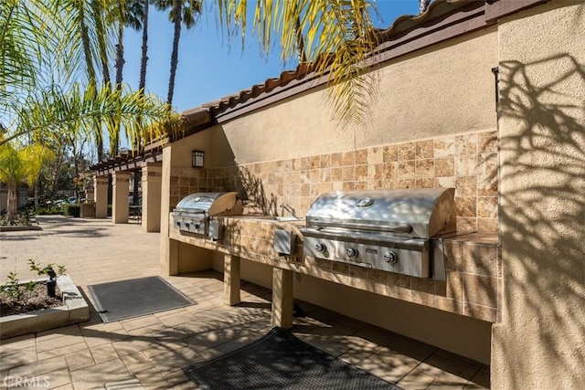 view of patio / terrace featuring area for grilling and an outdoor kitchen