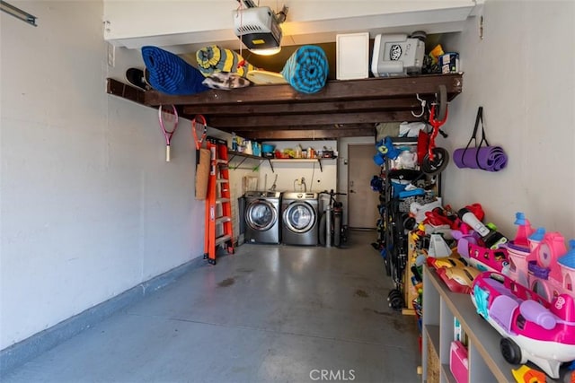 garage featuring a garage door opener and washing machine and clothes dryer