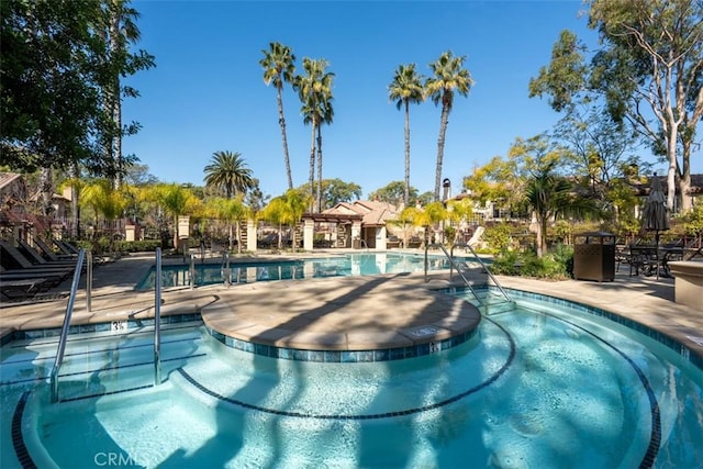 view of swimming pool featuring a patio area