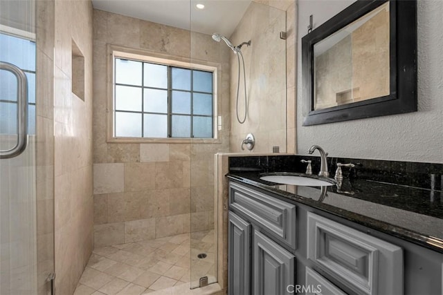 bathroom with vanity and an enclosed shower