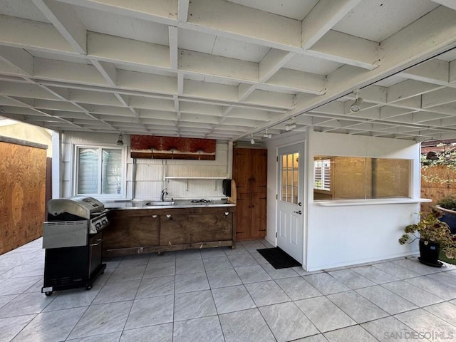 view of patio with a grill and sink