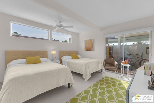 bedroom featuring vaulted ceiling with beams and ceiling fan