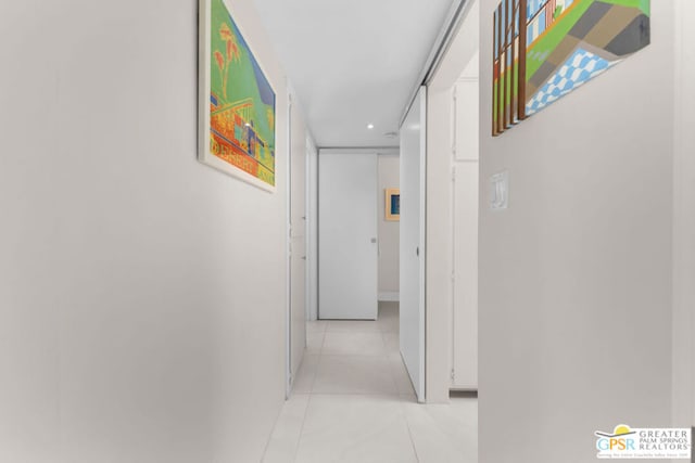 hallway featuring light tile patterned floors