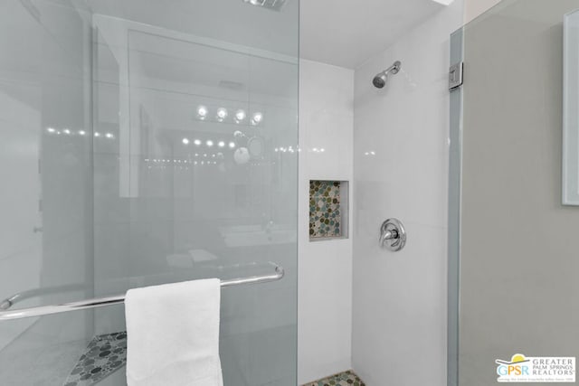 bathroom with a shower with shower door