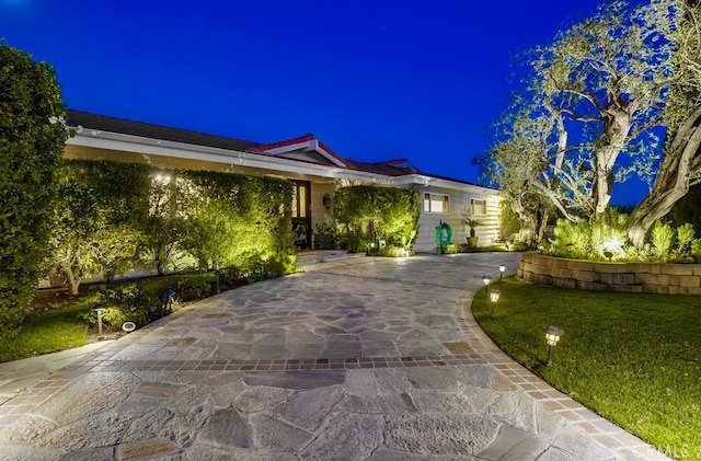 ranch-style house with a lawn