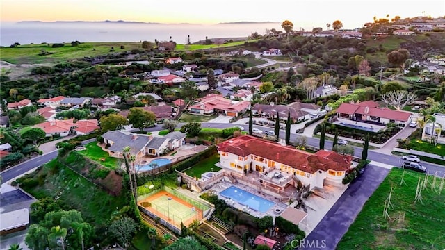 aerial view at dusk with a water view