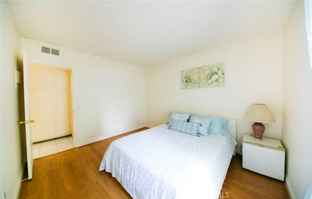 bedroom featuring hardwood / wood-style flooring