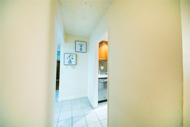 corridor with light tile patterned flooring