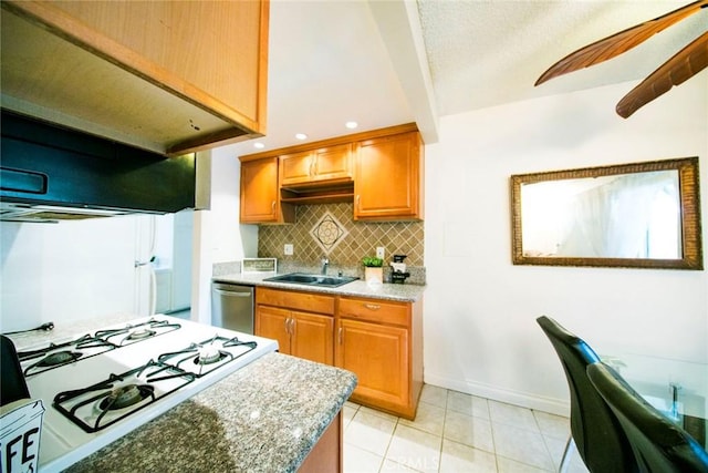 kitchen with dishwasher, sink, backsplash, and light stone counters