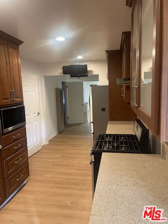 kitchen featuring stainless steel appliances and light wood-type flooring