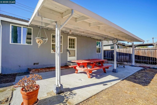 view of patio / terrace featuring an outdoor fire pit