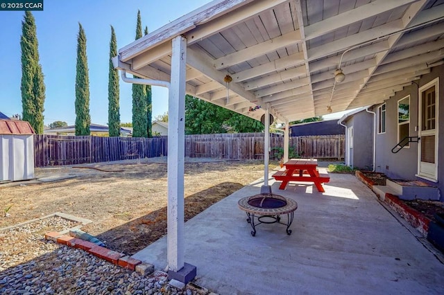 view of patio with an outdoor fire pit