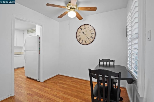 dining area featuring ceiling fan and light wood-type flooring