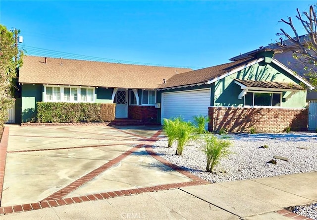 ranch-style house featuring a garage