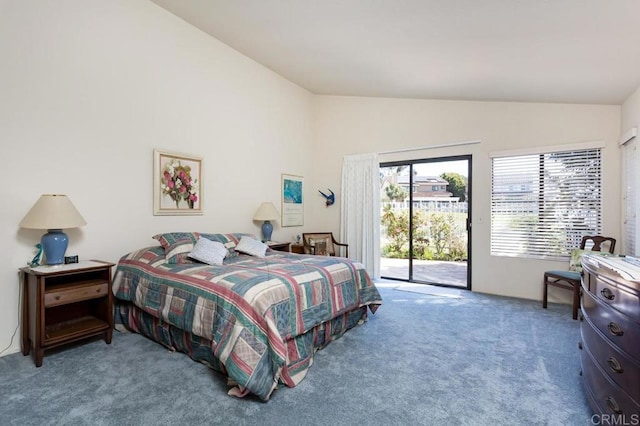 carpeted bedroom with vaulted ceiling and access to outside