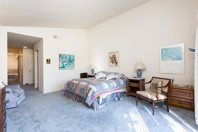 carpeted bedroom featuring vaulted ceiling