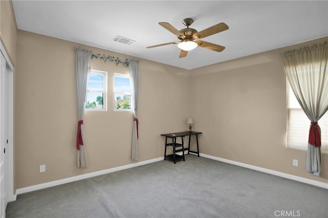 unfurnished room with carpet floors and ceiling fan