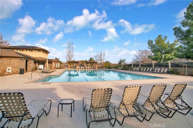 view of swimming pool featuring a patio area