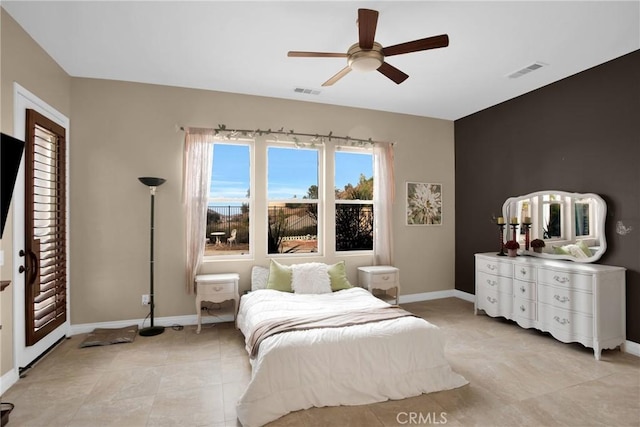 tiled bedroom featuring ceiling fan