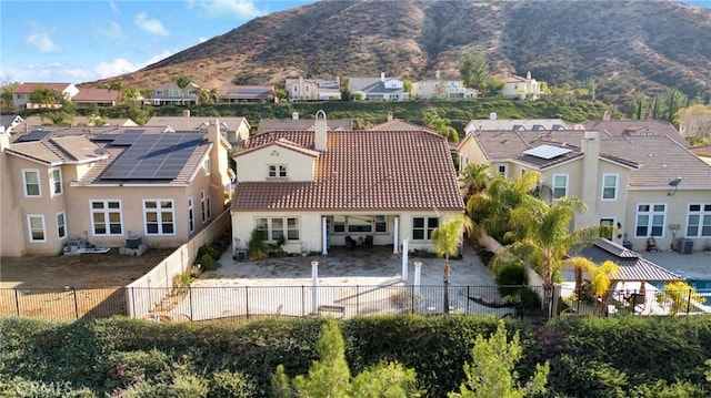 birds eye view of property with a mountain view